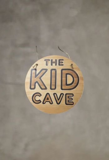 The Kid Cave Sign Printed On Neutral Plywood